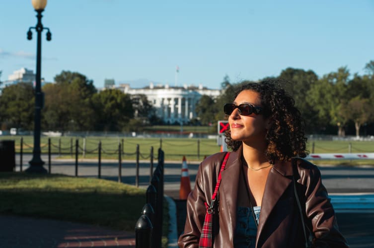 An image of a travel and portrait in a landmark with a introspective atmosphere.