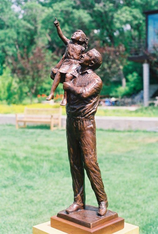 Dad Holding Daughter On Right Shoulder.jpg