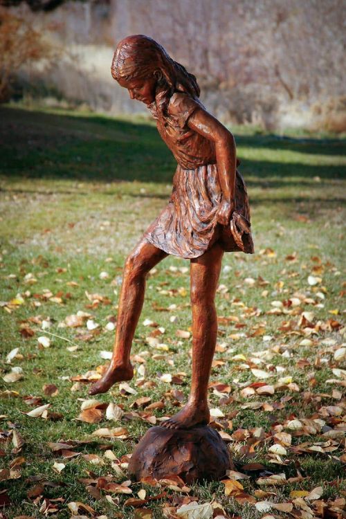 Girl Balancing On A Rock.jpg