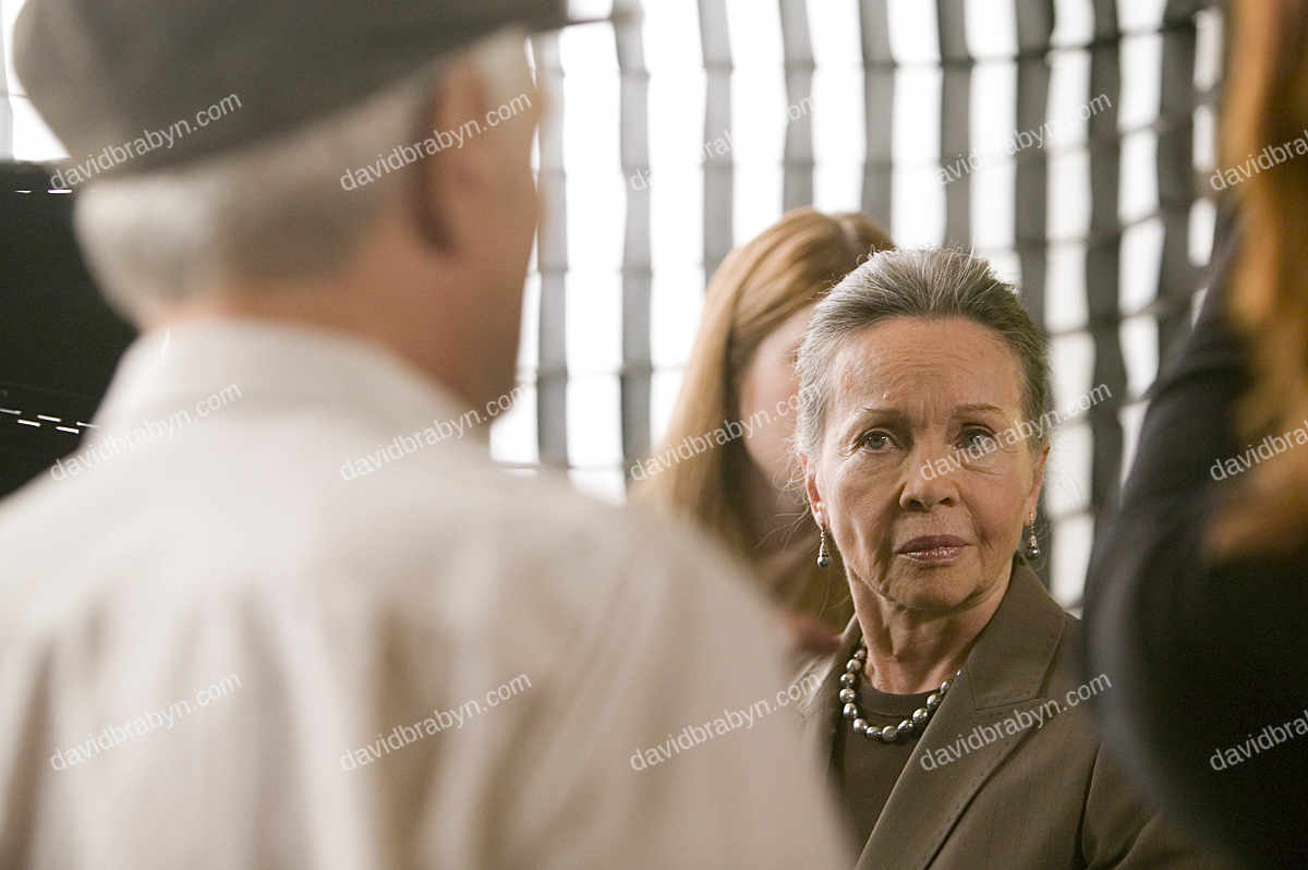 French actress Leslie Caron (3L) listens to director Ted Kotcheff (L) on the studio set of television show "Law & Order: SVU" in North Bergen, USA, 8 May 2006.