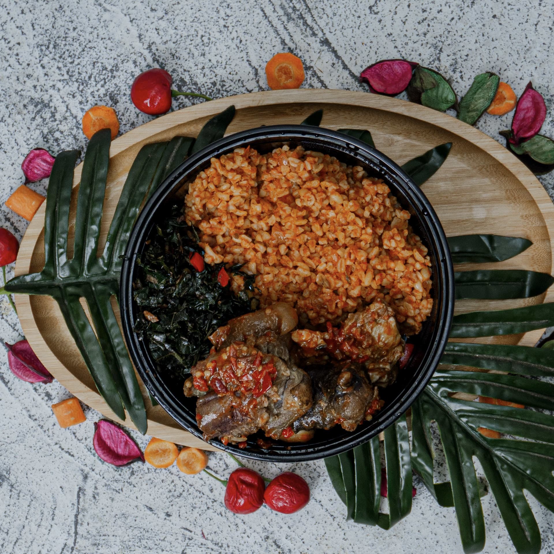 Jollof Bulgur with Peppered Goat & Leafy Greens