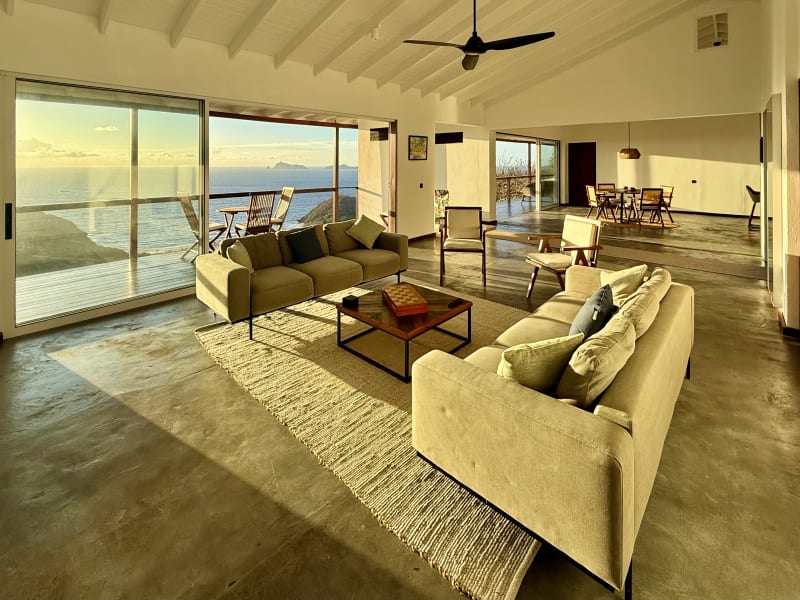Penthouse living room flooded with golden sunrise light