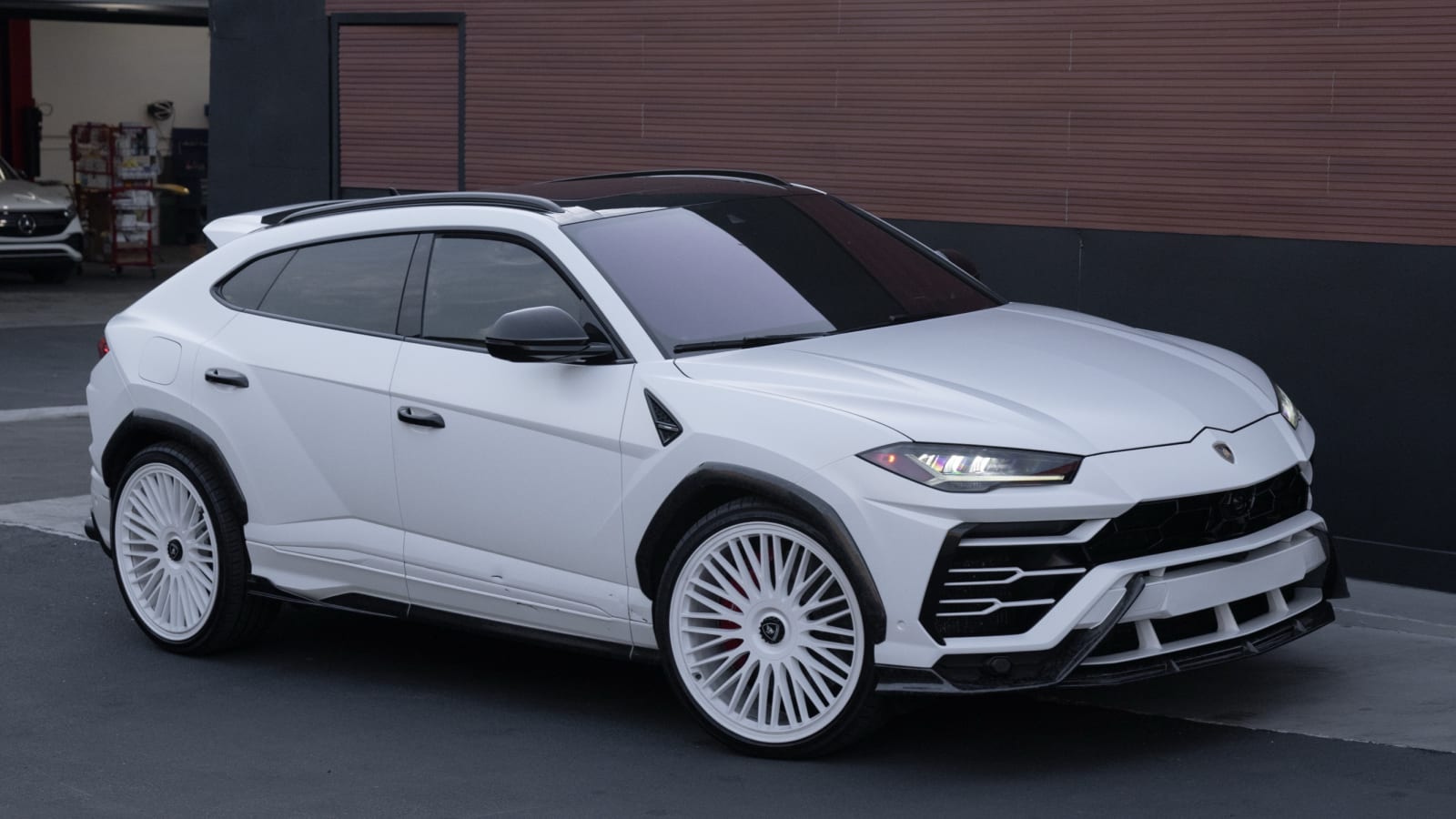 White Lamborghini Urus at Pristine Collision Center