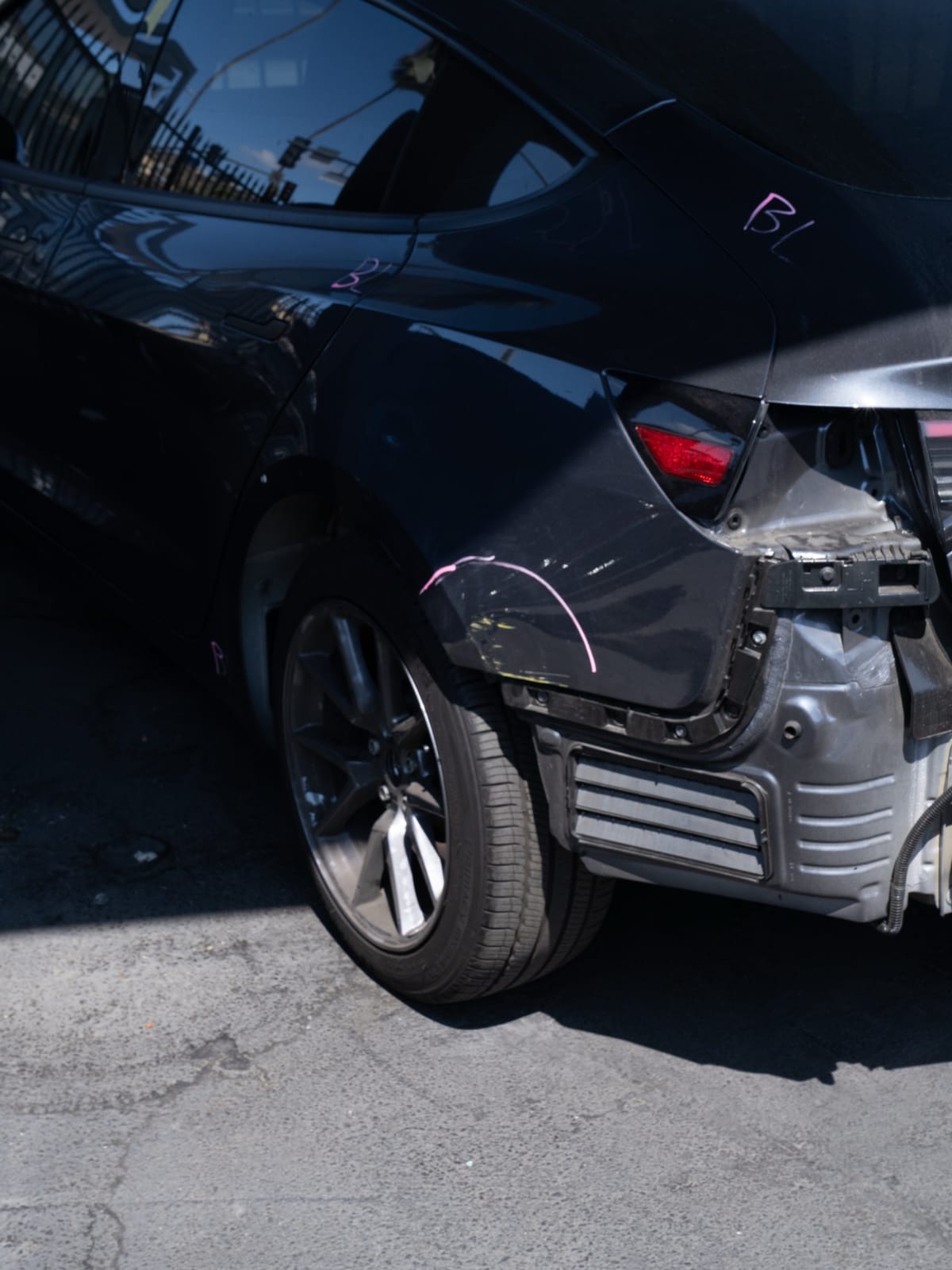 Estimator markup on a rear-ended Tesla Model 3 at the Hollywood shop