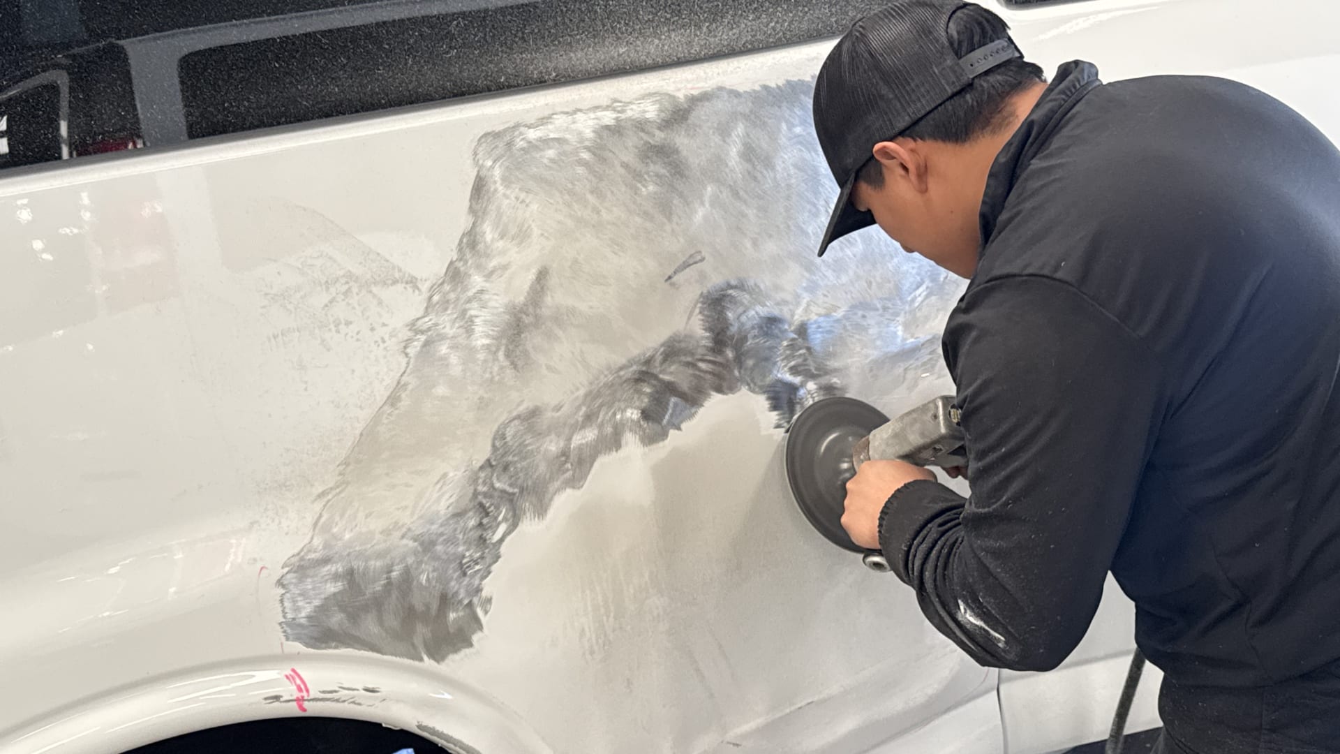 Technician working on body panel — Elite Collision Houston