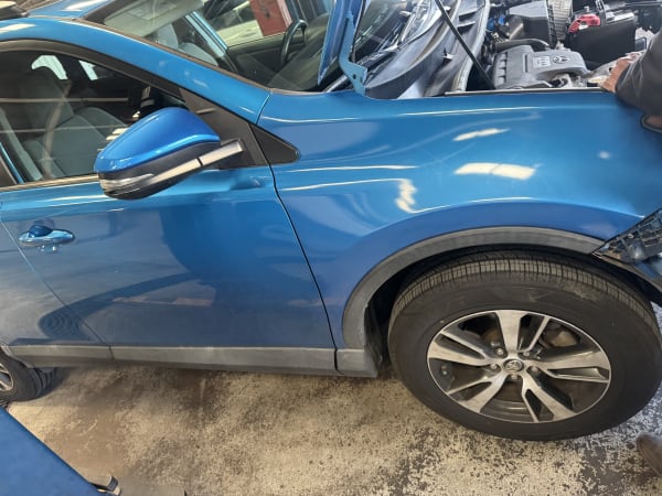 Completed blue SUV paint finish