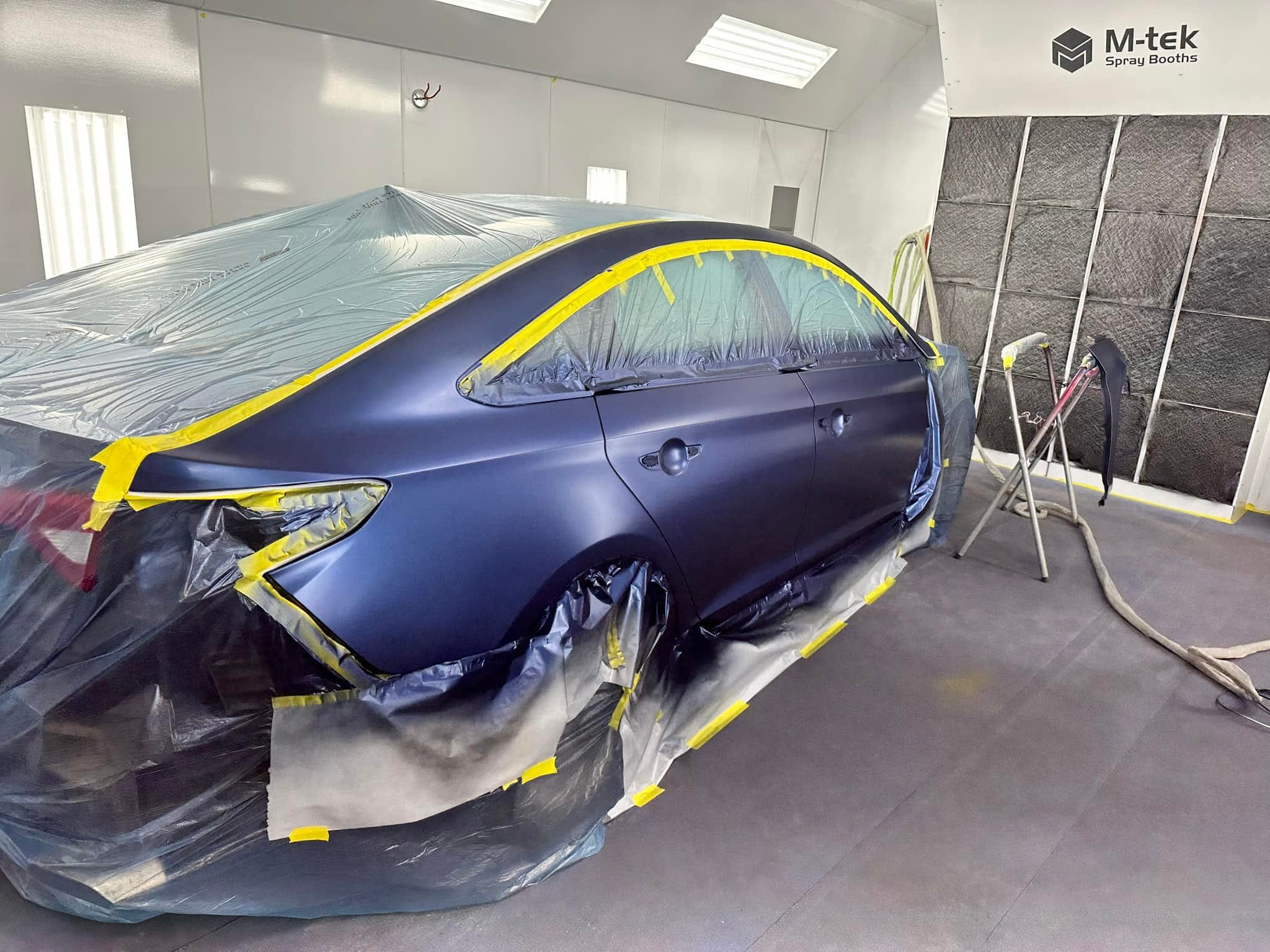 Vehicle in spray booth