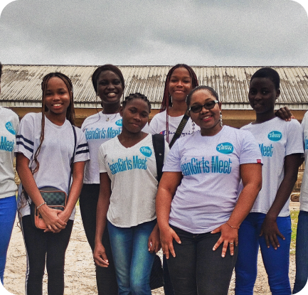 Group of volunteers in matching t-shirts working together on community outreach initiatives