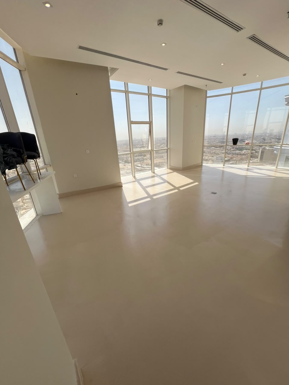 Minimalist architectural microcement floor with warm tone creating sophisticated ambiance