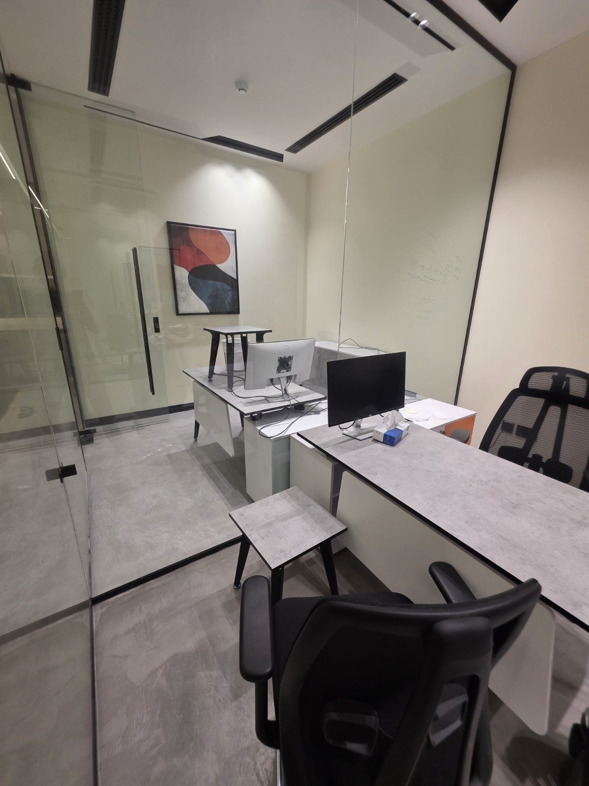 Modern interior with grey microcement flooring system showcasing sleek contemporary design