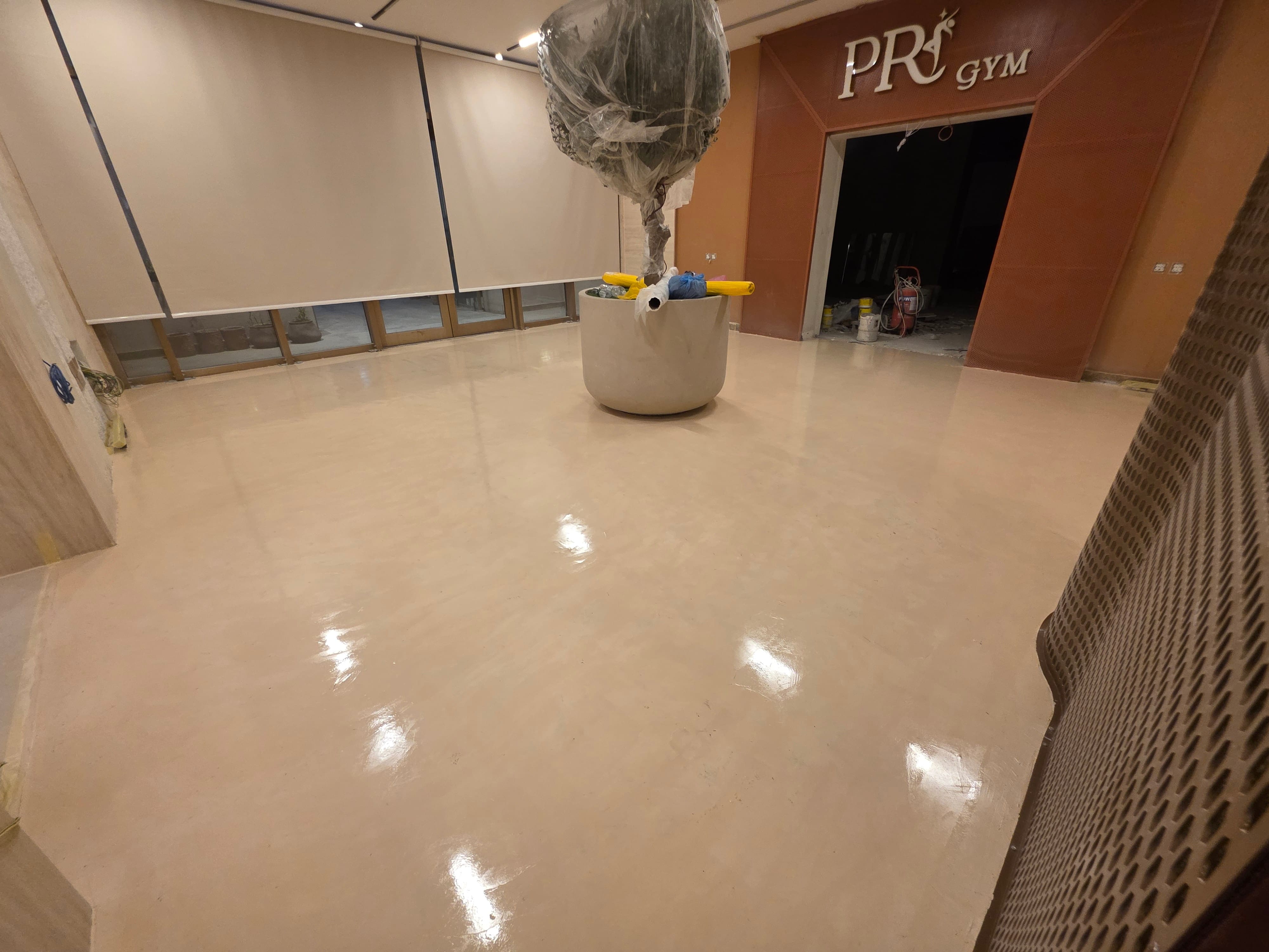 Dark grey seamless microcement flooring in residential villa with sophisticated finish