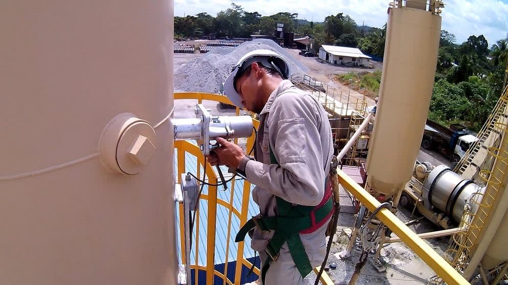 LKS technician installing an analyzer on an industrial stack