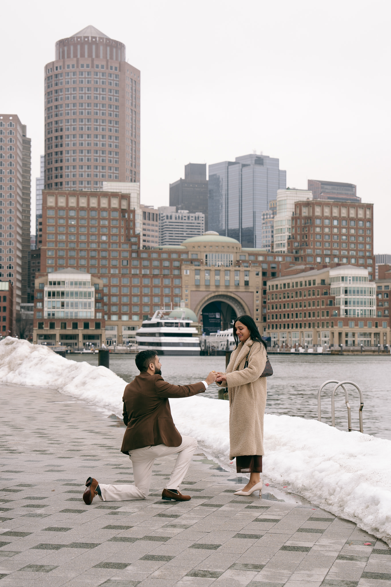 Jay on one knee during the surprise proposal