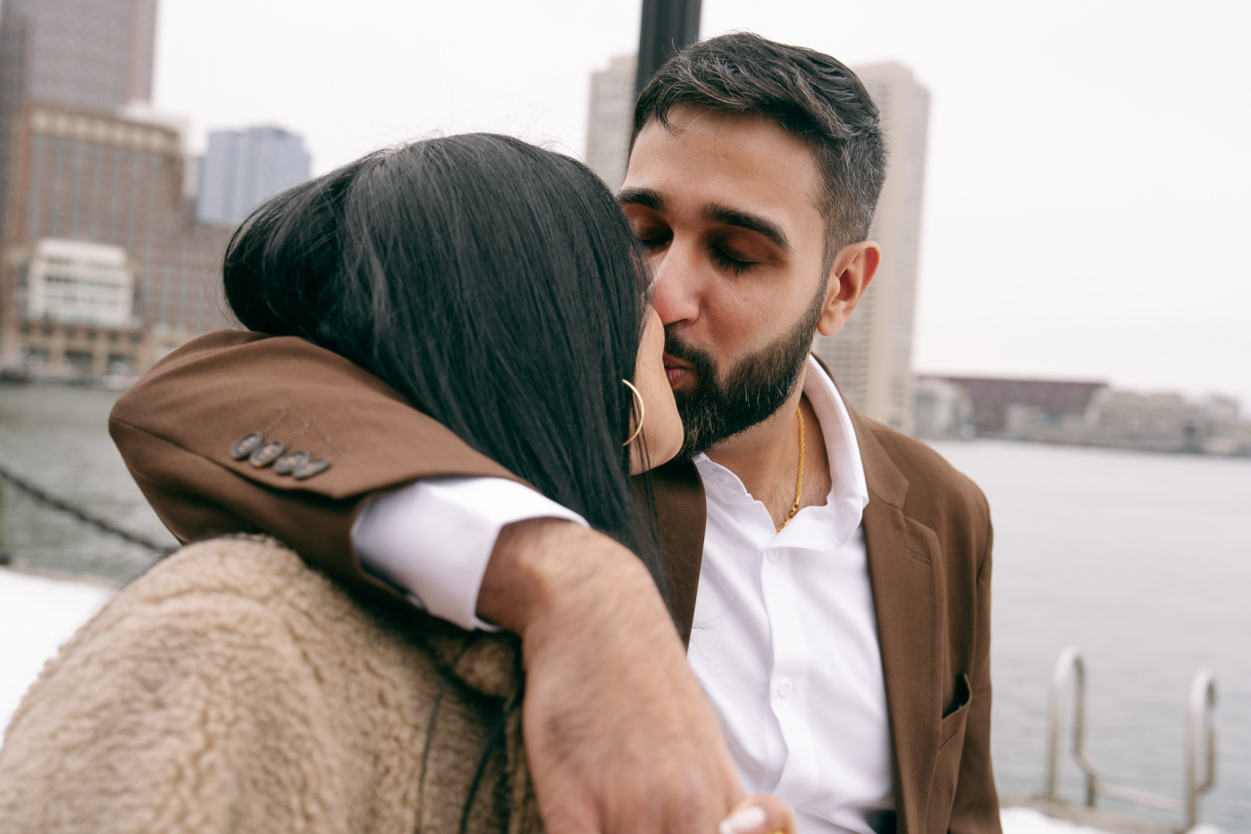 Jay and Amrita walking along the waterfront
