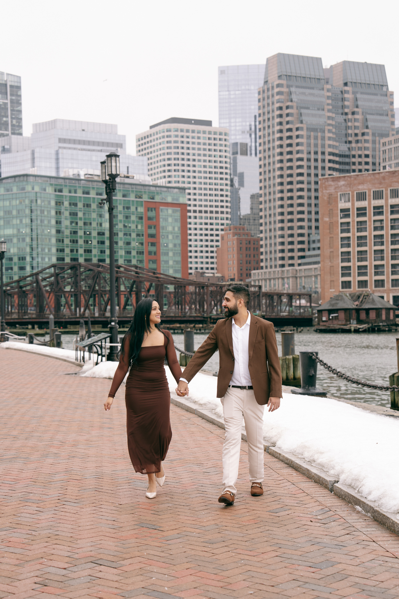 Jay and Amrita laughing together by the water