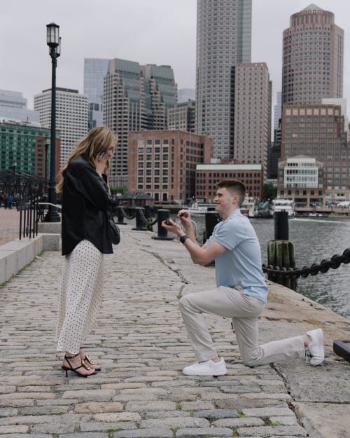 Surprise proposal photography for John and Hannah at Boston Seaport