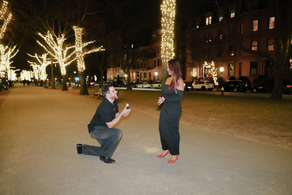 Ryan dropping to one knee for the surprise proposal in Back Bay