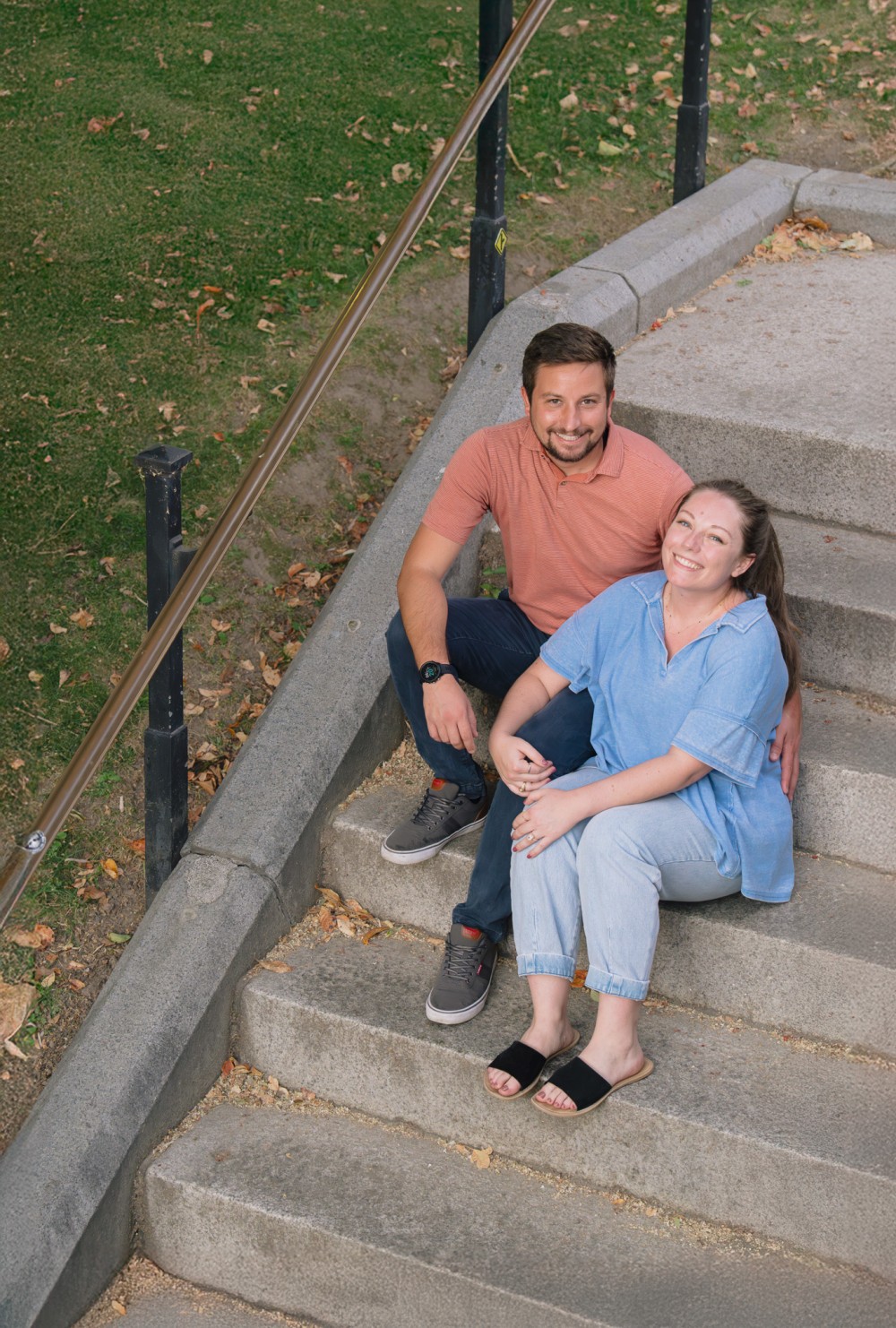 Alex and Kendyl sitting together for their final engagement portrait
