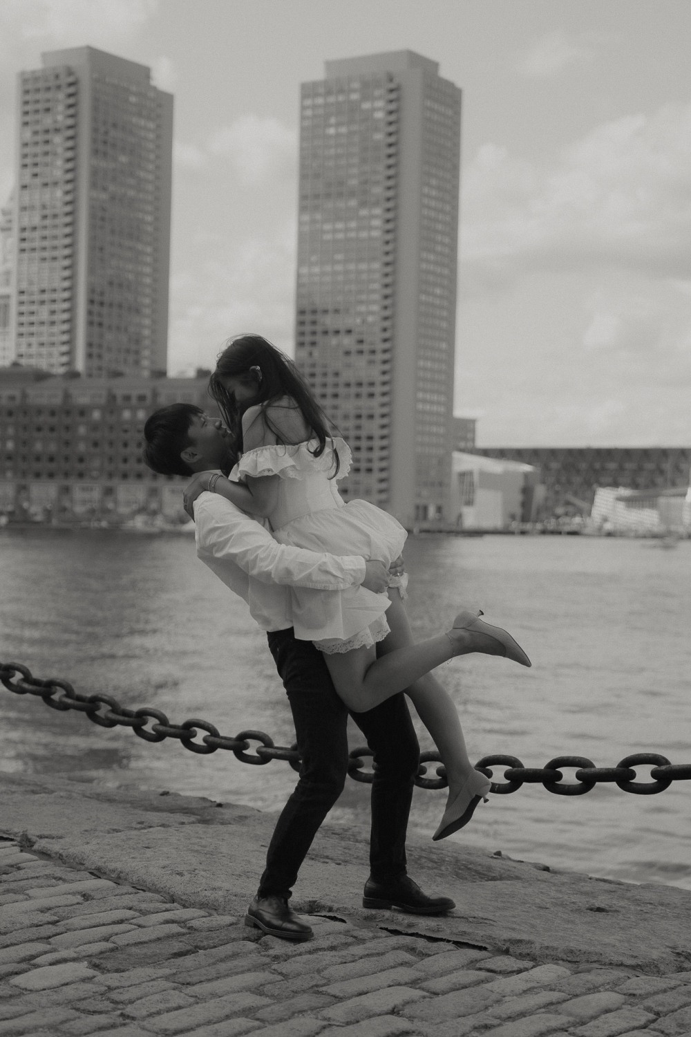 Final engagement portrait of Daniel and Steffi at Boston Seaport