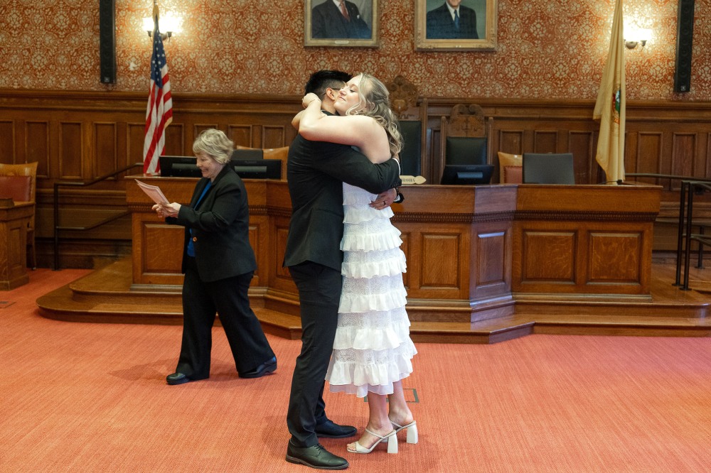 Couple exchanging vows during a city hall ceremony