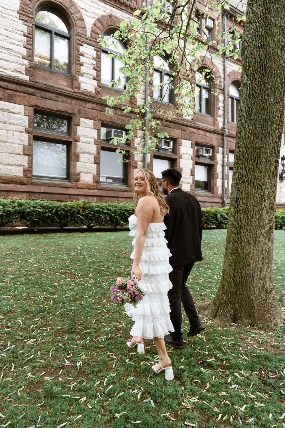 Newlyweds outside historic building
