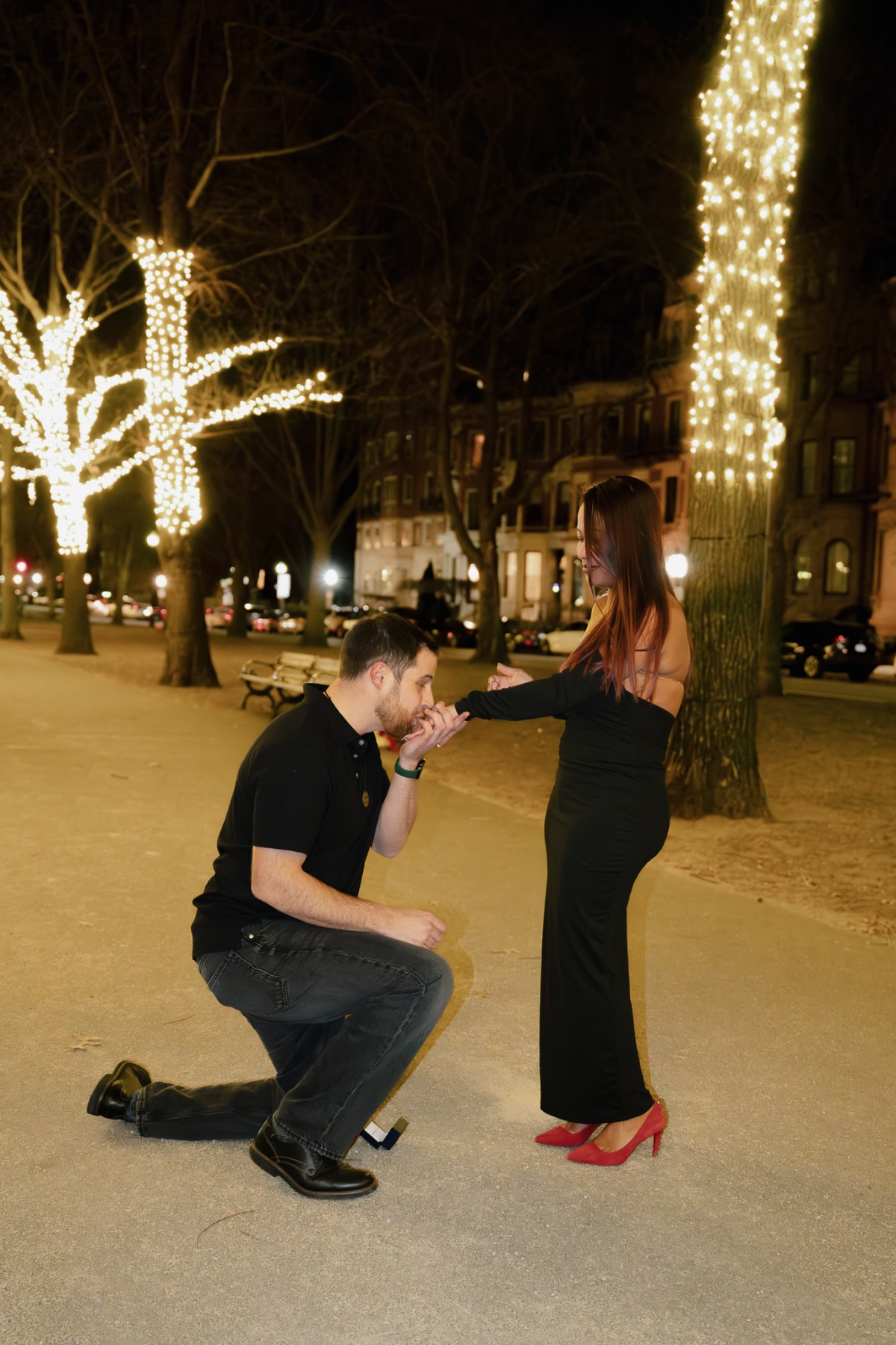 Ryan and Sophanya celebrating after their Commonwealth Avenue Mall proposal