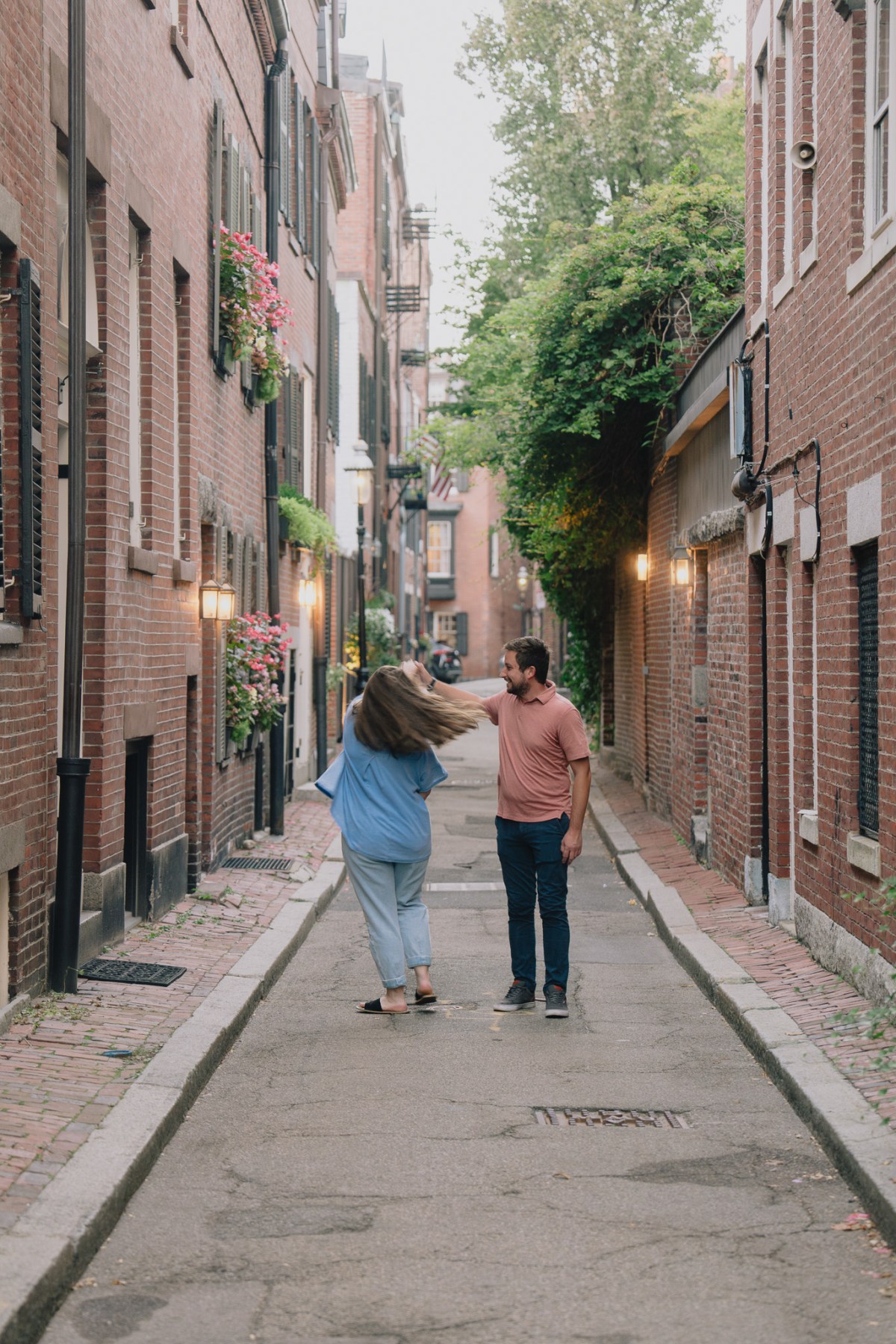 Alex and Kendyl, newly engaged, on a Beacon Hill street