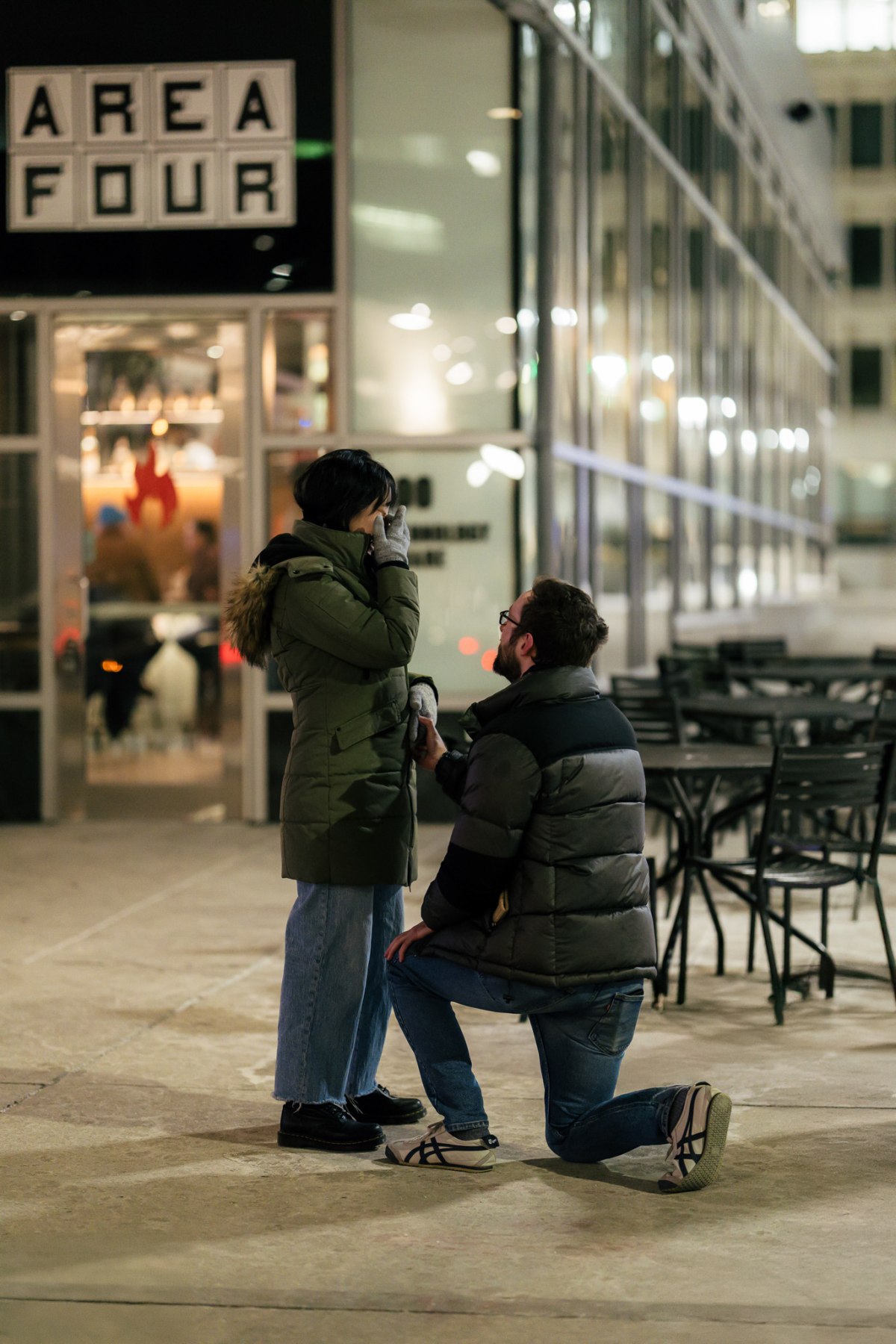 Travis and Grace embracing after the proposal