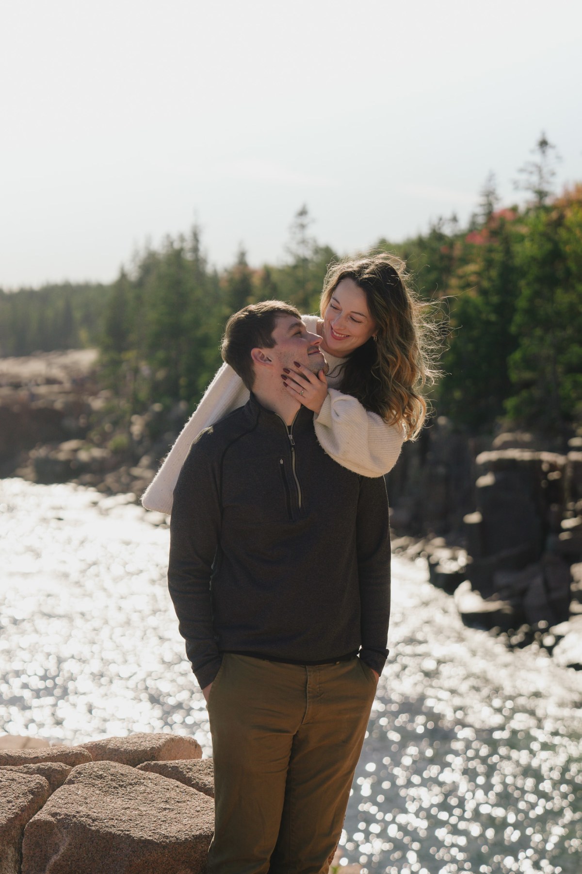 Griffin and Hannah during their Acadia engagement session along a coastal path