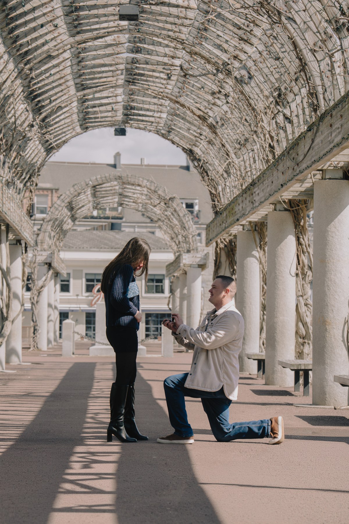 Ben and Ally during their proposal at Christopher Columbus Park on the Boston waterfront