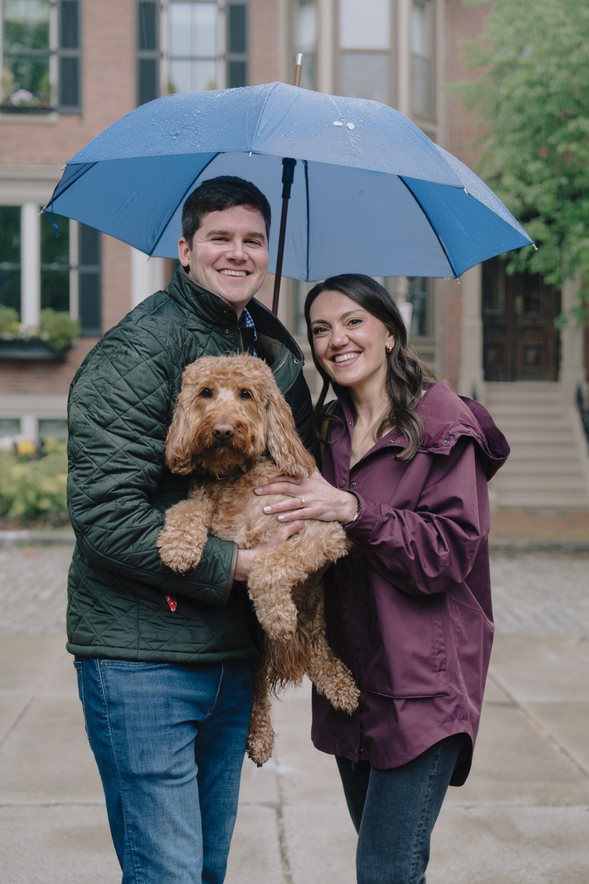 A couple celebrating after a proposal in Back Bay