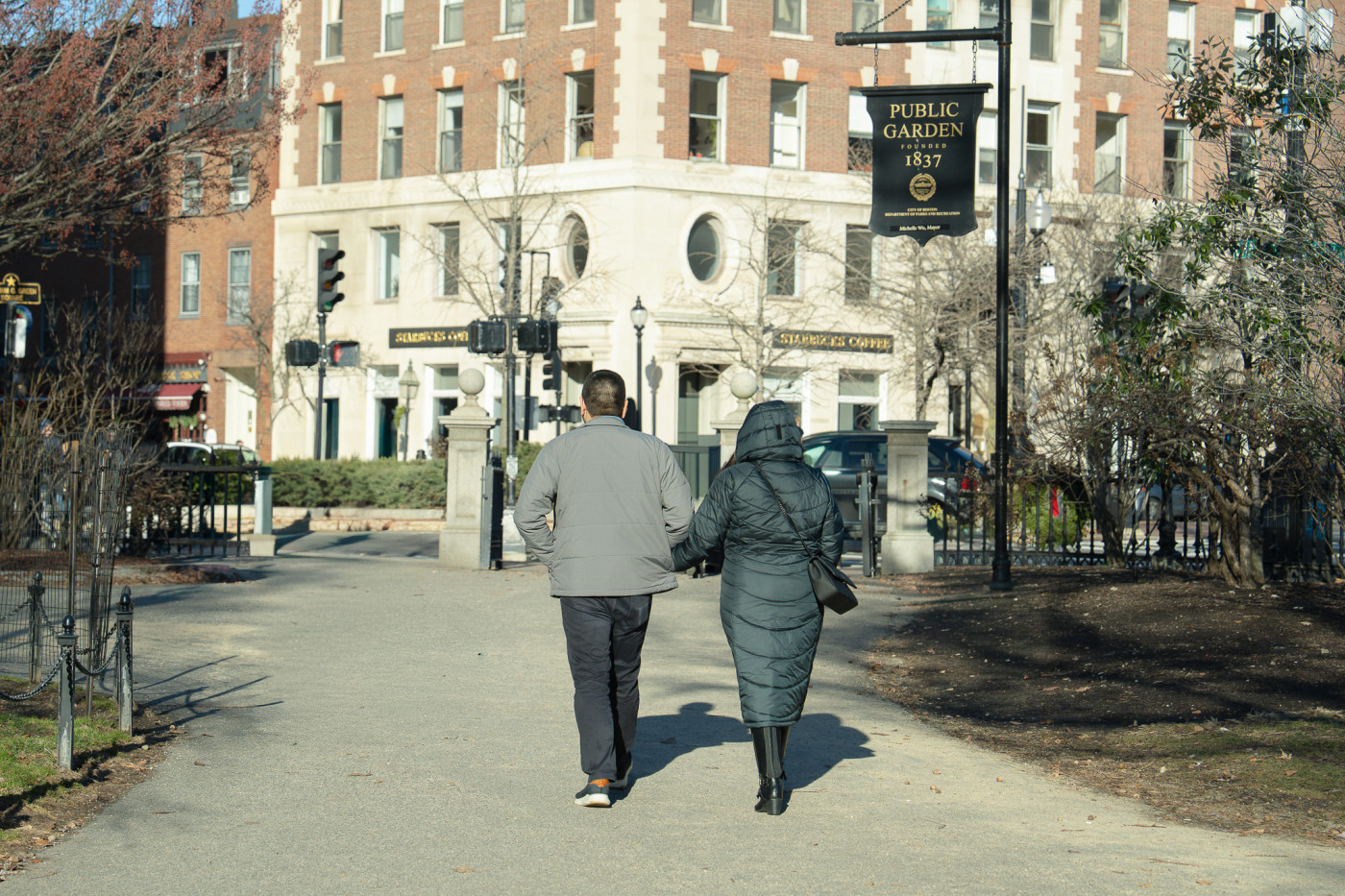 Brijesh and Janelle walking through Boston Public Garden before the proposal