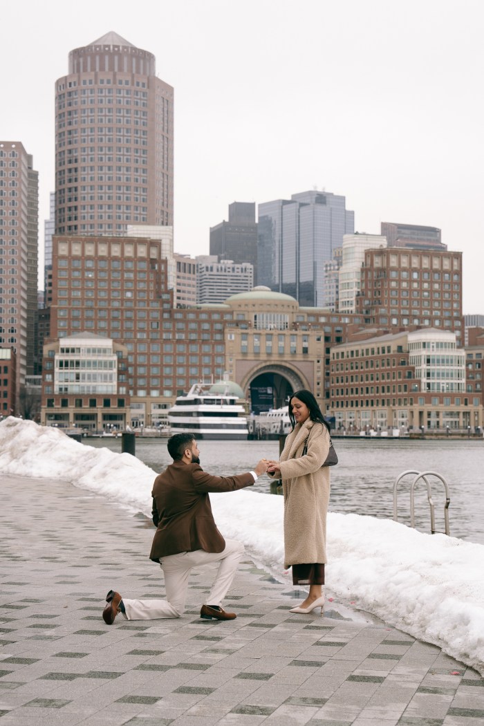 Jay on one knee during the surprise proposal