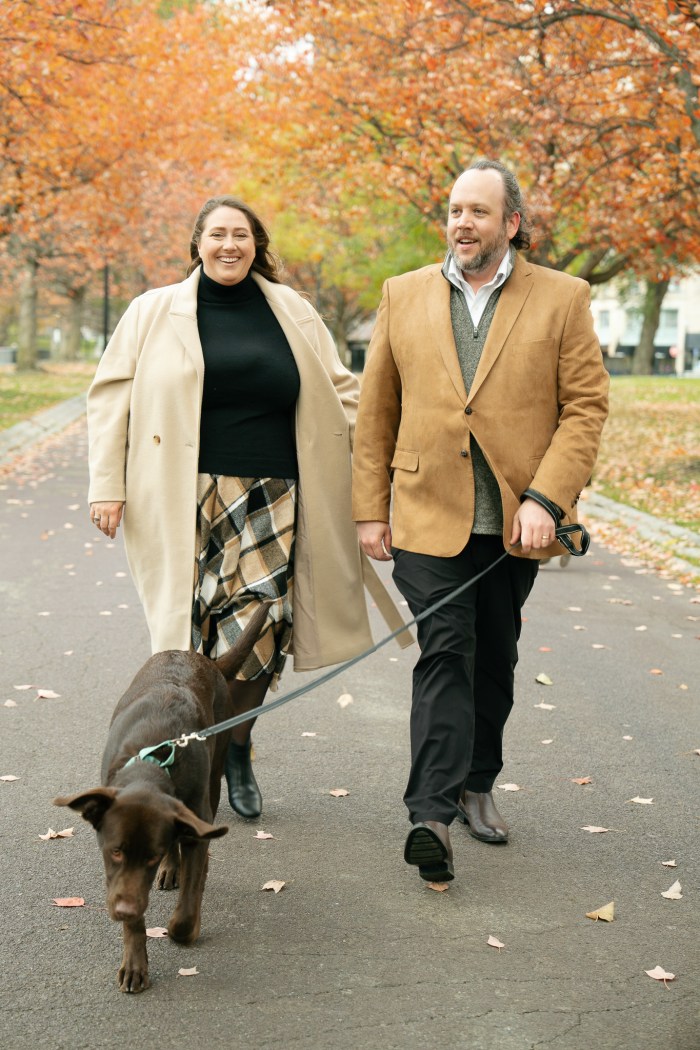 Family walking down the path with Teddy the puppy