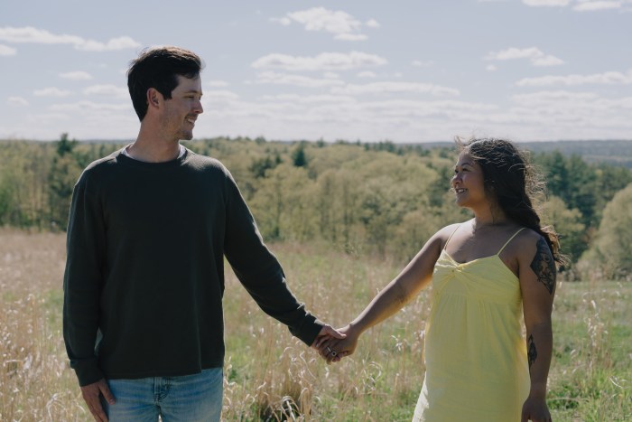 Candid portrait of Colin and Nikkie walking the garden paths