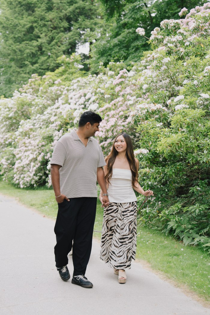 Rohan and Kim An standing together among the trees at the Arnold Arboretum