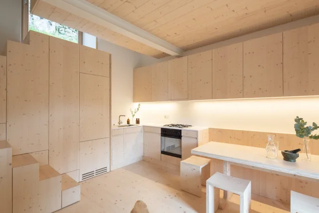 Spacious bedroom with double bed and mountain view