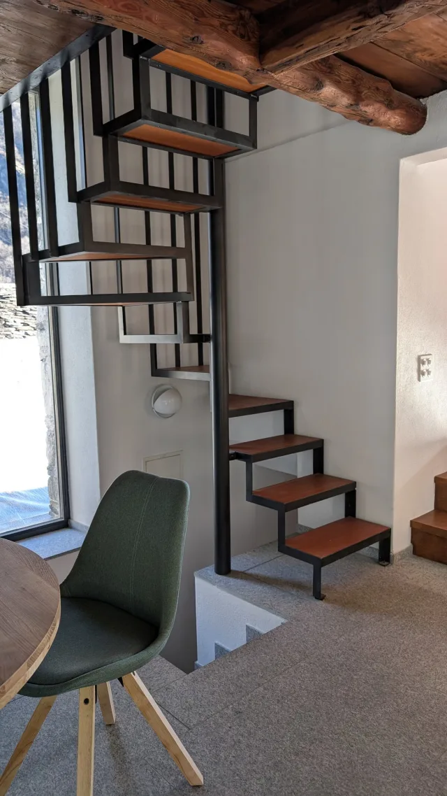 Cozy bedroom with exposed wooden beams