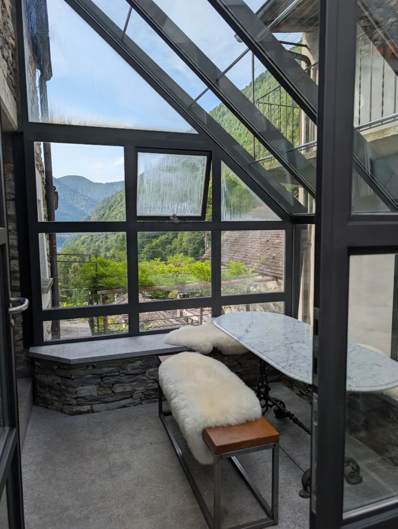 Bright sunroom with mountain views