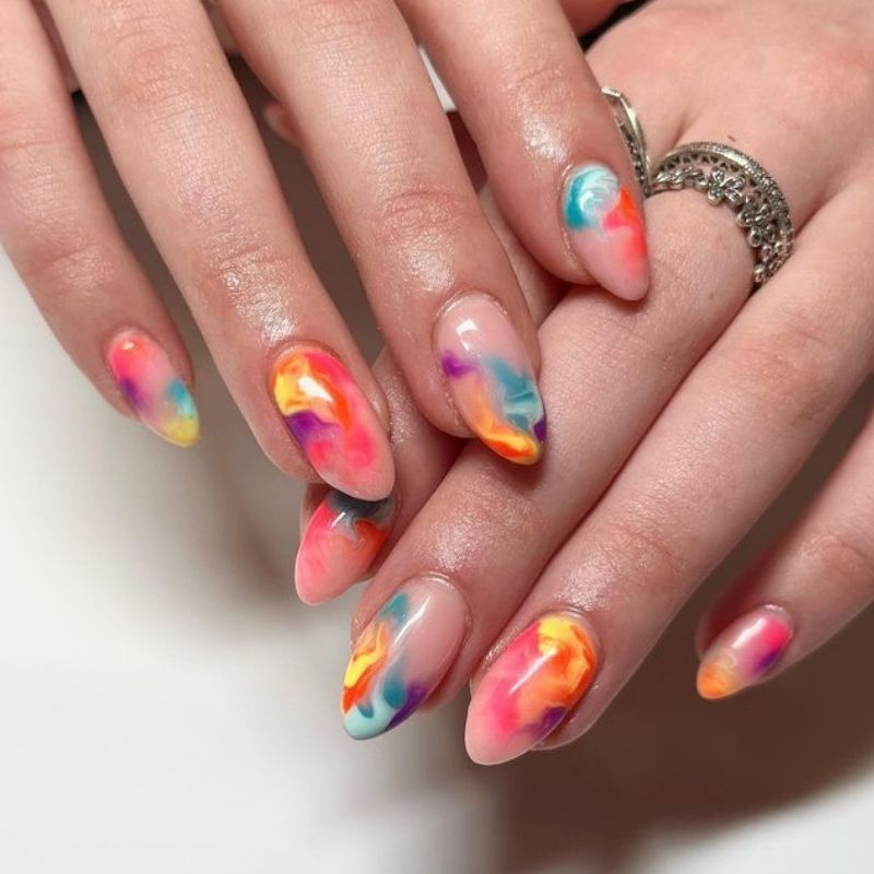Unique abstract art nails with blooming gel technique featuring artistic color combinations