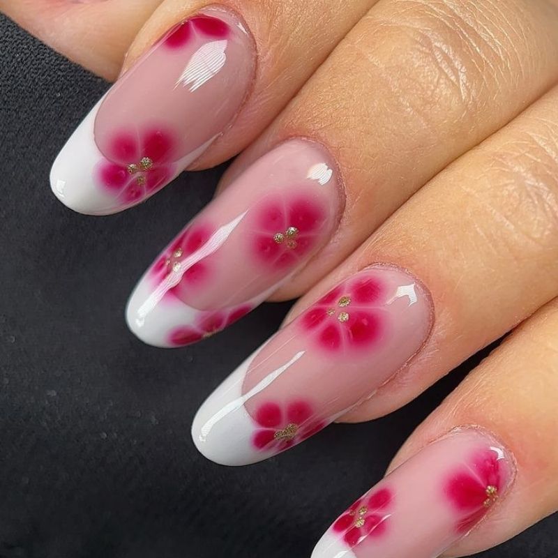 Blooming gel flower nail art with five-petal pink blossoms on nude base