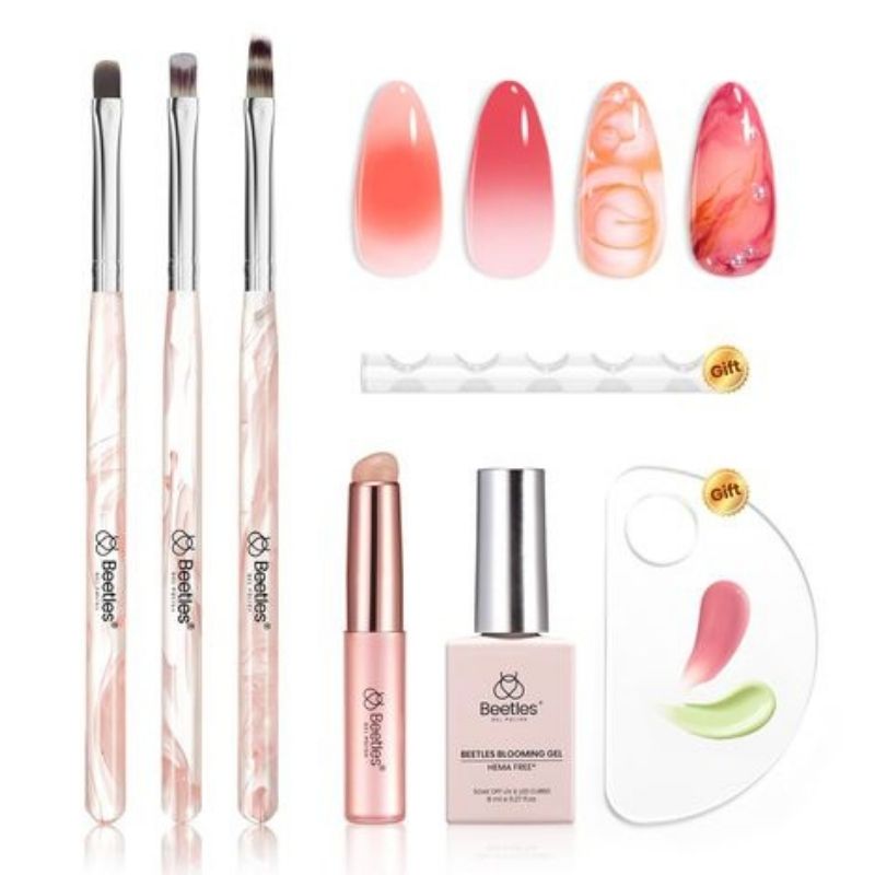 Blooming gel nail art essential tools including clear gel bottle dotting tools and UV lamp