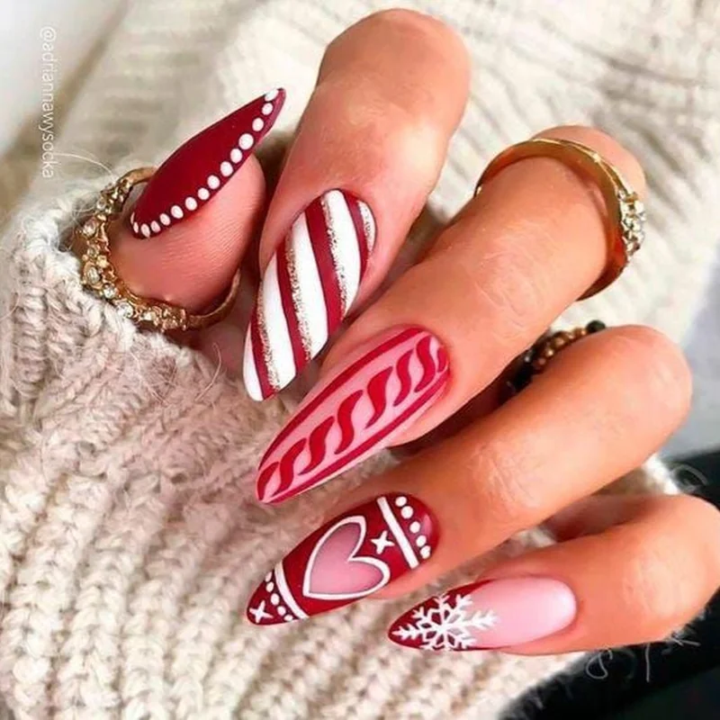 Dimensional 3D candy cane nail art with realistic textured charms and embellishments