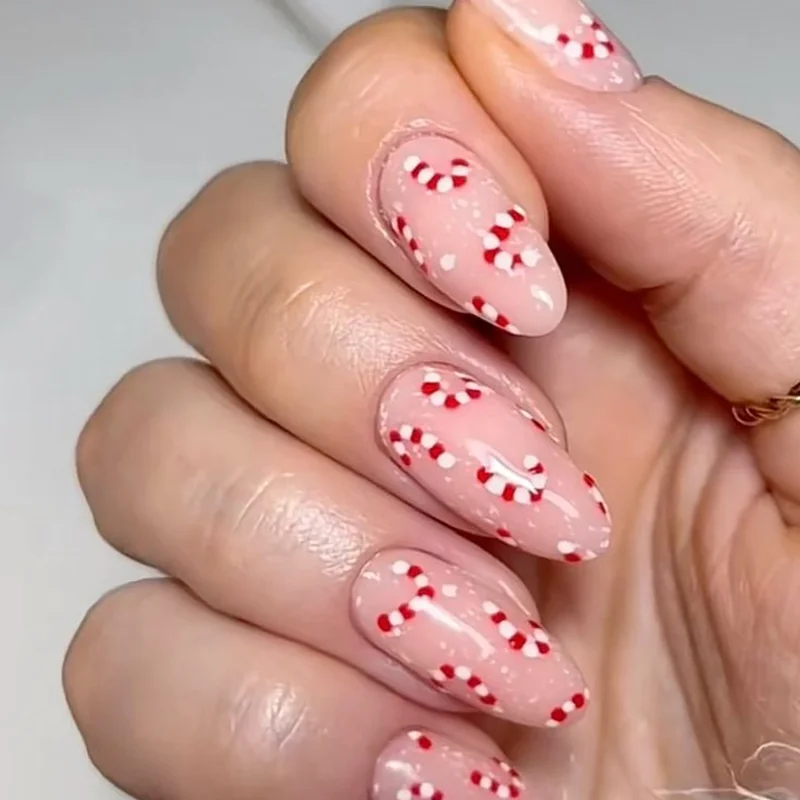 Simple minimalist candy cane accent nails with single red stripe on white base