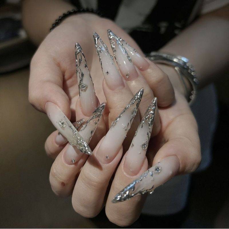 Long stiletto goddess nails with dramatic length