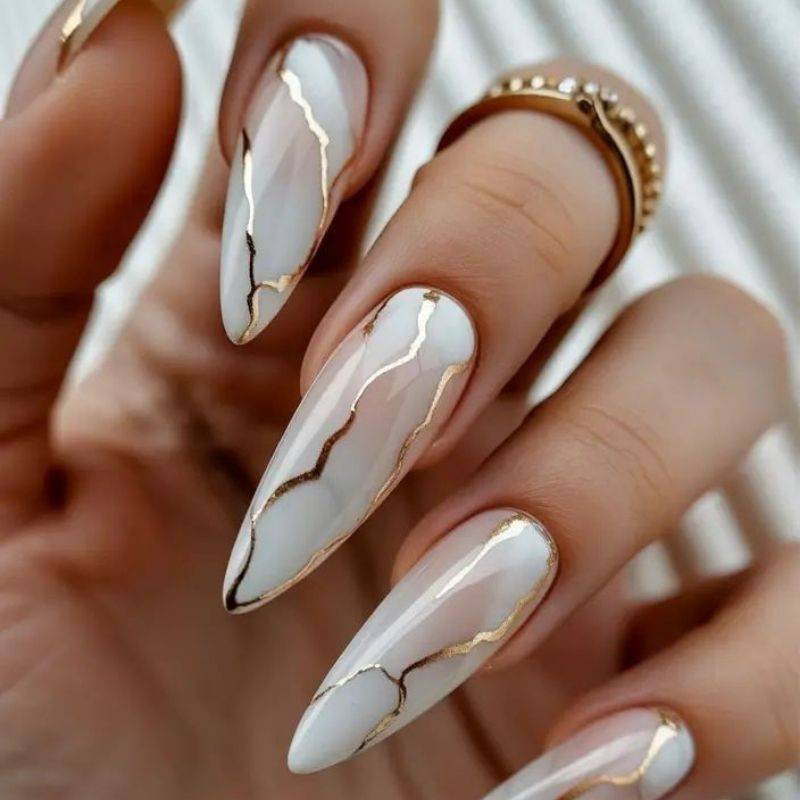Marble effect goddess nails with gold accents