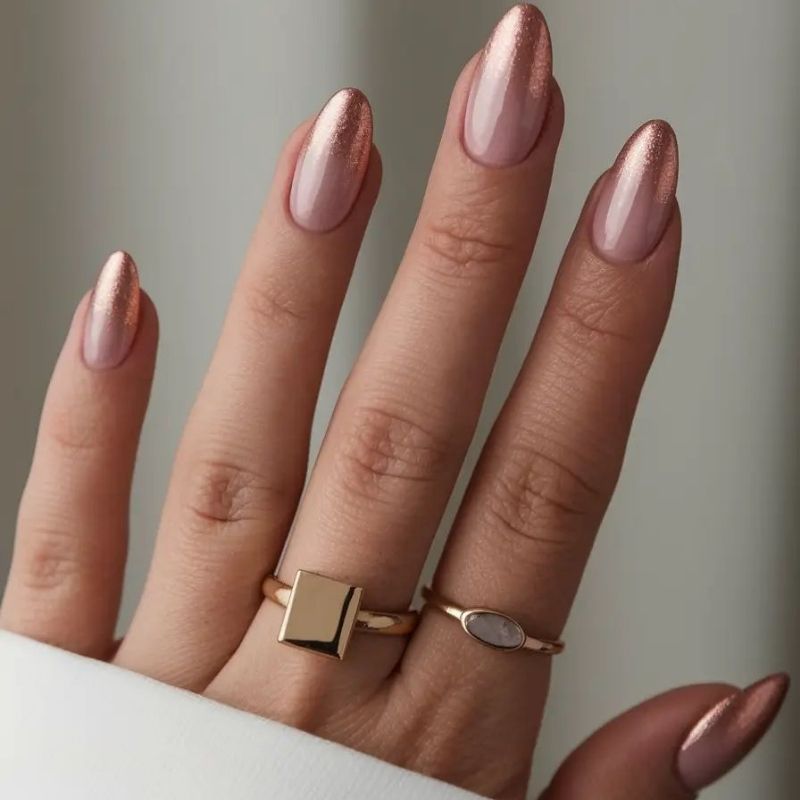 rose gold chrome christmas nails with french tip gradient ombre metallic finish on coffin shape