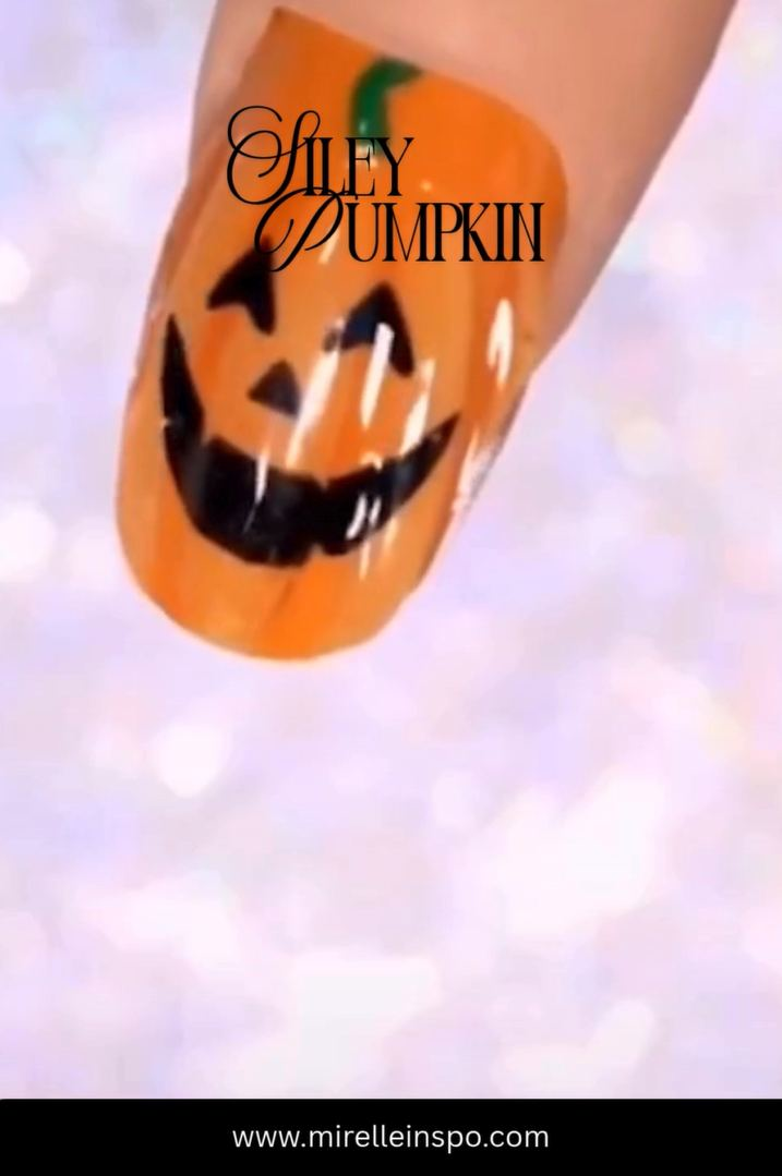 Cute pumpkin face Halloween nail art design