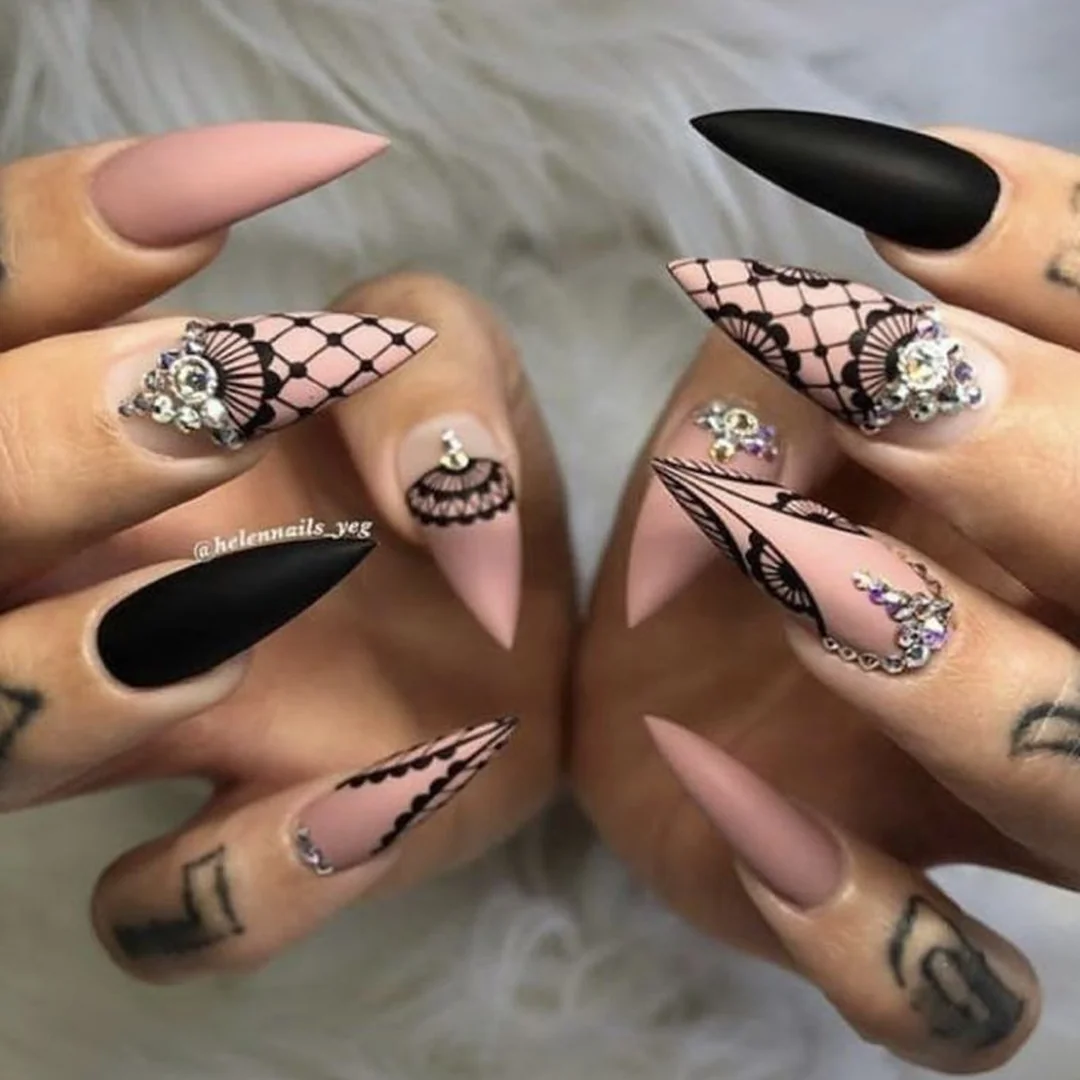 Lace Valentine nails featuring intricate white overlay patterns with negative space on sheer pink base