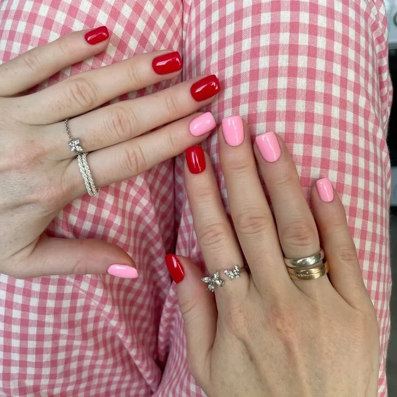 Monochrome mismatched Valentine nails showing different tones within same color family